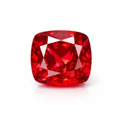 Czerwony, fasetowany **spinel** o kształcie poduszki, lśniący w świetle.