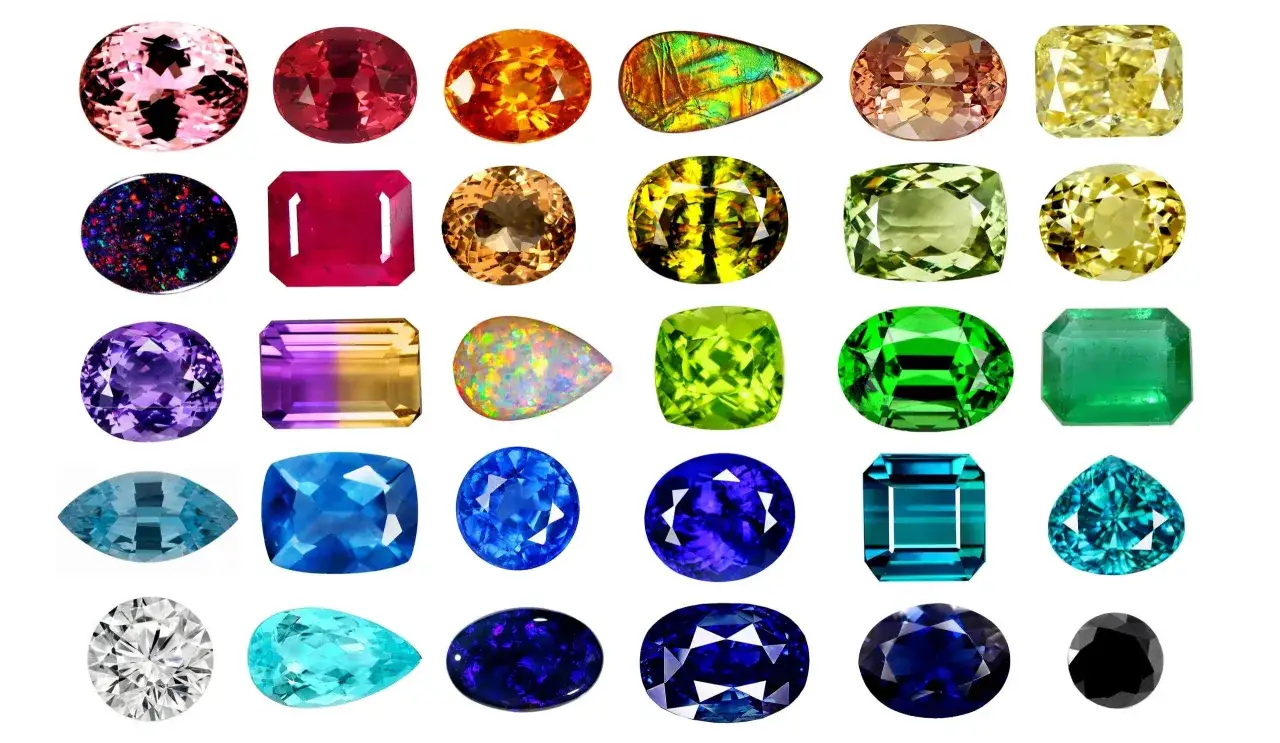 Kolekcja kolorowych kamieni szlachetnych: różowy morganit, rubin, pomarańczowy szafir, ametyst, szmaragd, topaz, diament i inne. Poznaj ich nazwy!